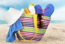 Beach bag with things on the sea